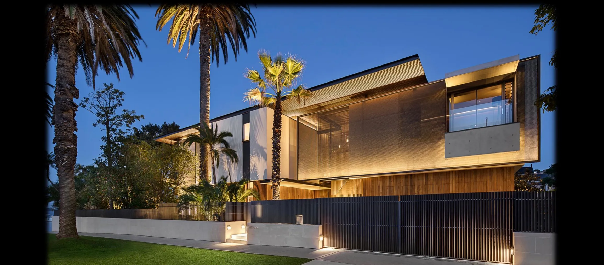 Sample villa design — timber-and-glass residence at dusk